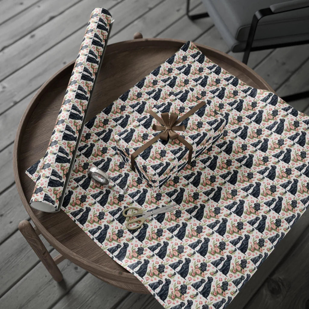 Black Lab in Bloom Wrapping Paper — gift wrapping presented on a wooden table