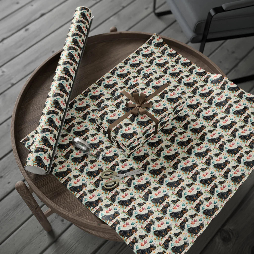 Birthday Rottweiler Wrapping Paper with Party Hats and Balloons — gift wrapping presented on a wooden table