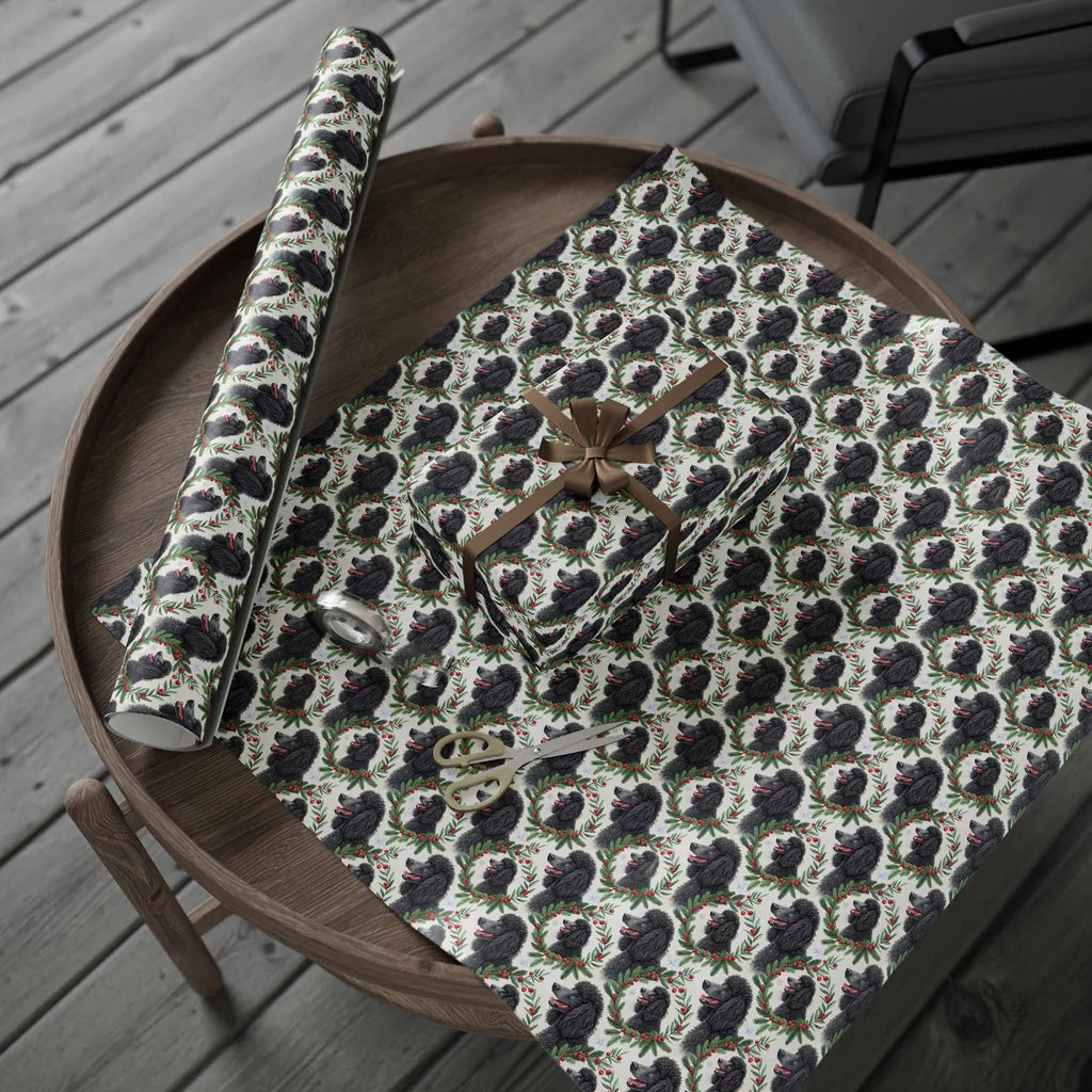 Fancy & Festive Black Poodle Christmas Wrapping Paper — gift wrapping presented on a wooden table