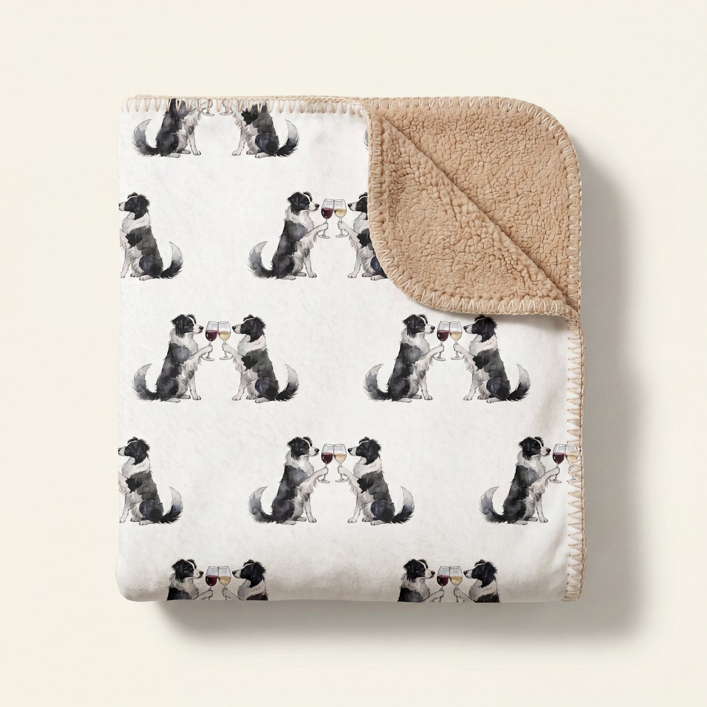Top-down product photo of the Happy Hour Border Collie sherpa blanket folded on a cream background