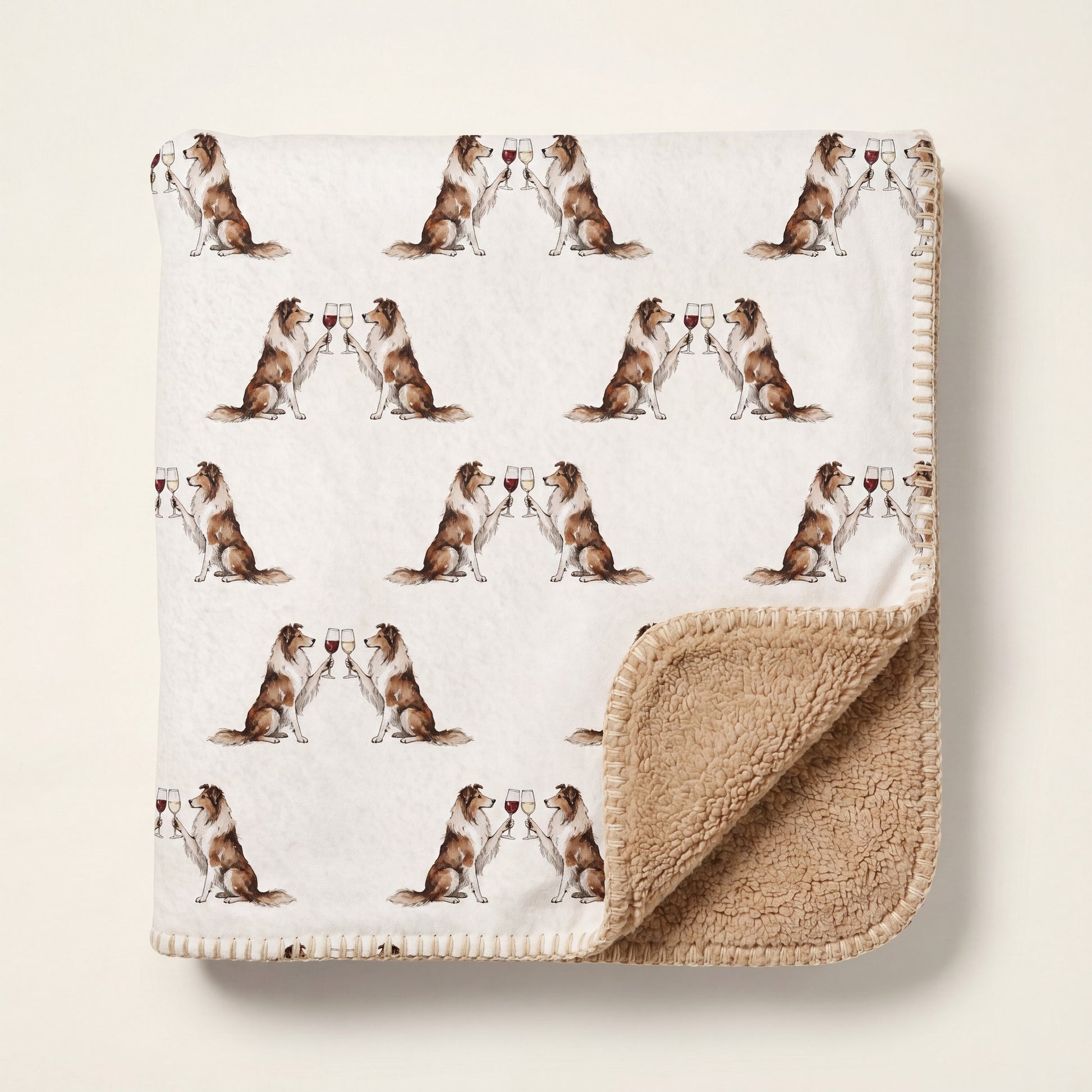 Top-down product photo of the Happy Hour Collie sherpa blanket folded on a cream background