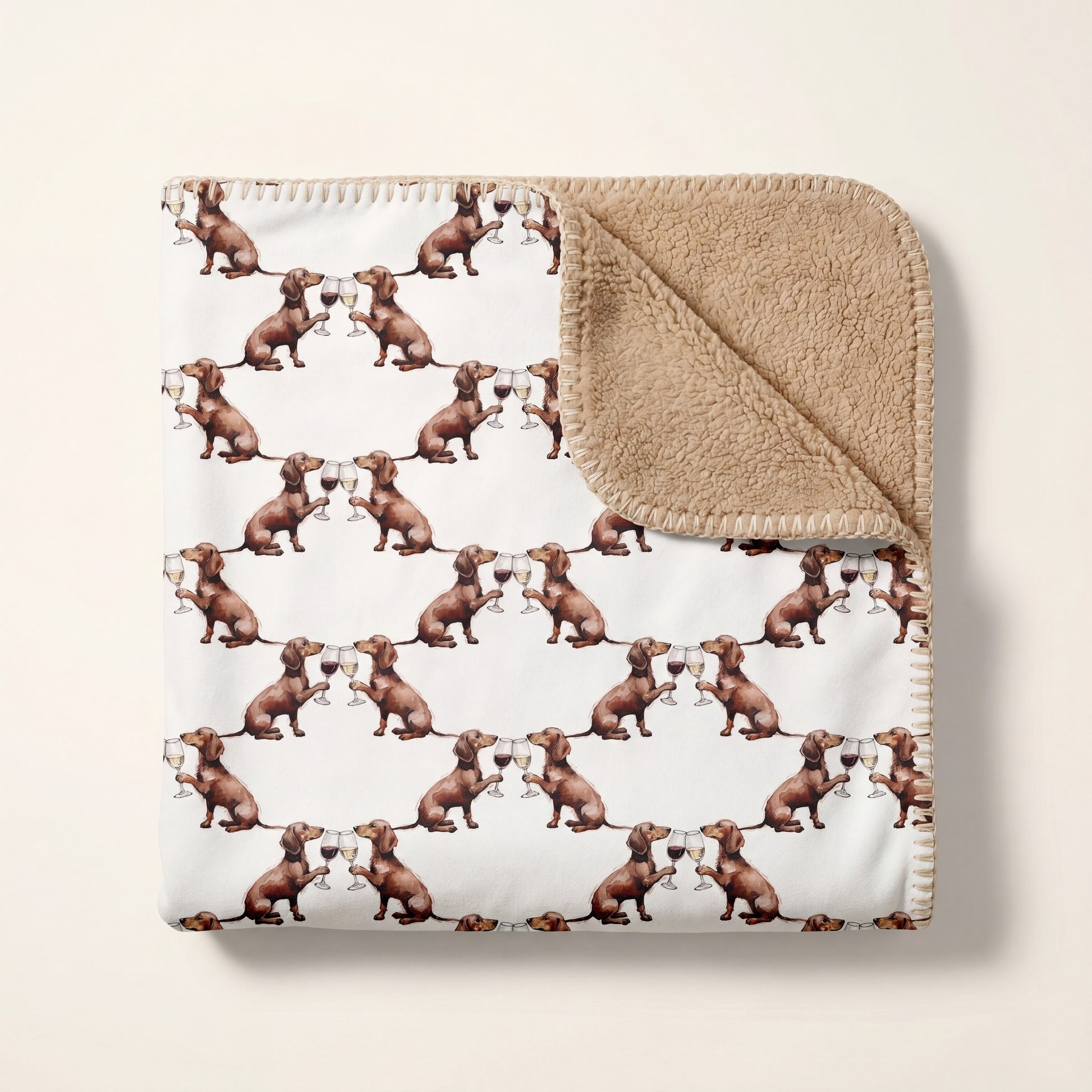 Top-down product photo of the Happy Hour Dachshund sherpa blanket folded on a cream background