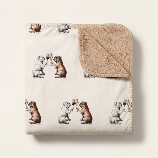 Top-down product photo of the Happy Hour English Bulldog sherpa blanket folded on a cream background