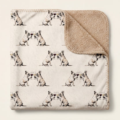 Top-down product photo of the Happy Hour French Bulldog sherpa blanket folded on a cream background