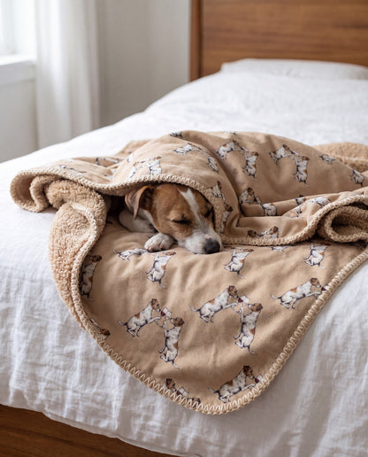 Jack Russell Terrier curled asleep in a Happy Hour Jack Russell Terrier sherpa blanket on a bed