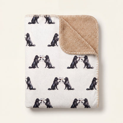 Top-down product photo of the Happy Hour Newfoundland sherpa blanket folded on a cream background
