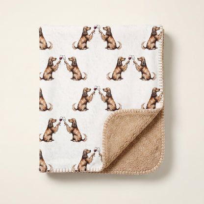 Top-down product photo of the Happy Hour Cocker Spaniel sherpa blanket folded on a cream background