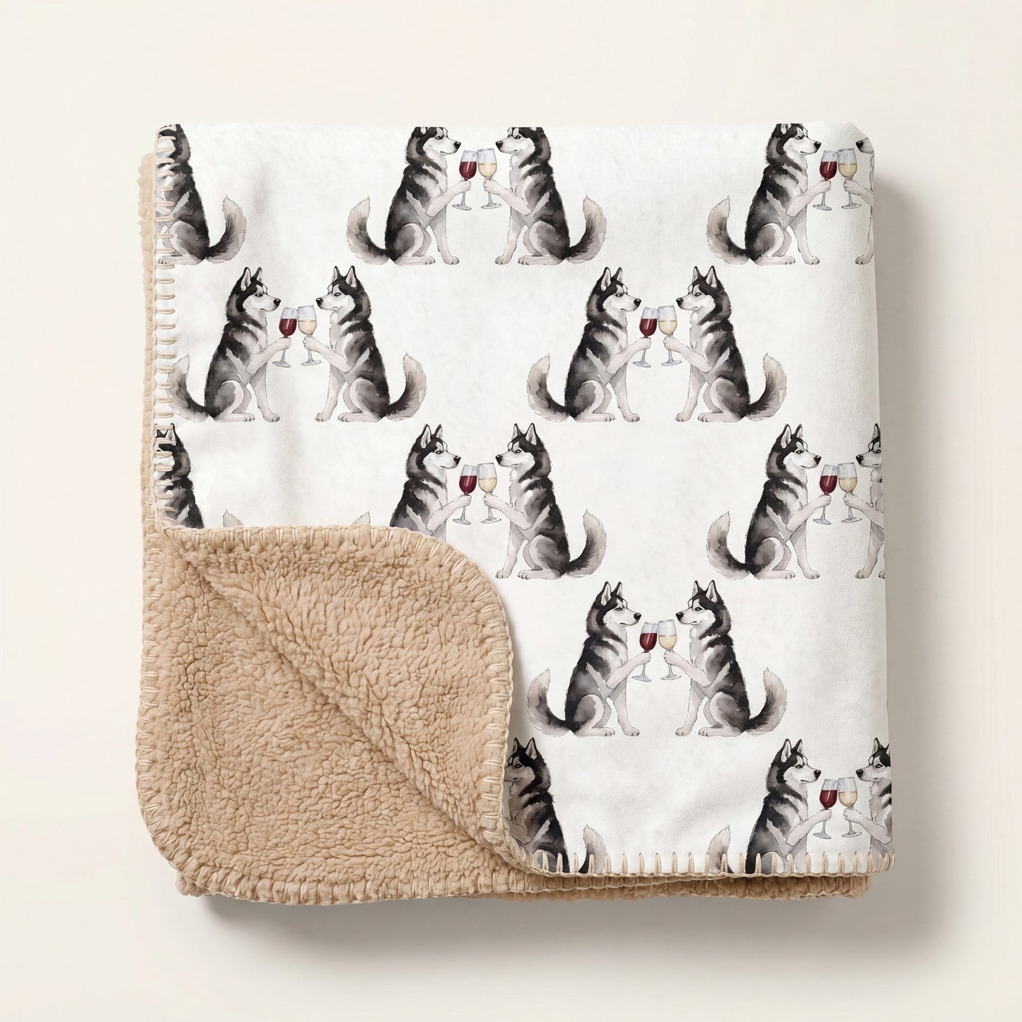 Top-down product photo of the Happy Hour Siberian Husky sherpa blanket folded on a cream background