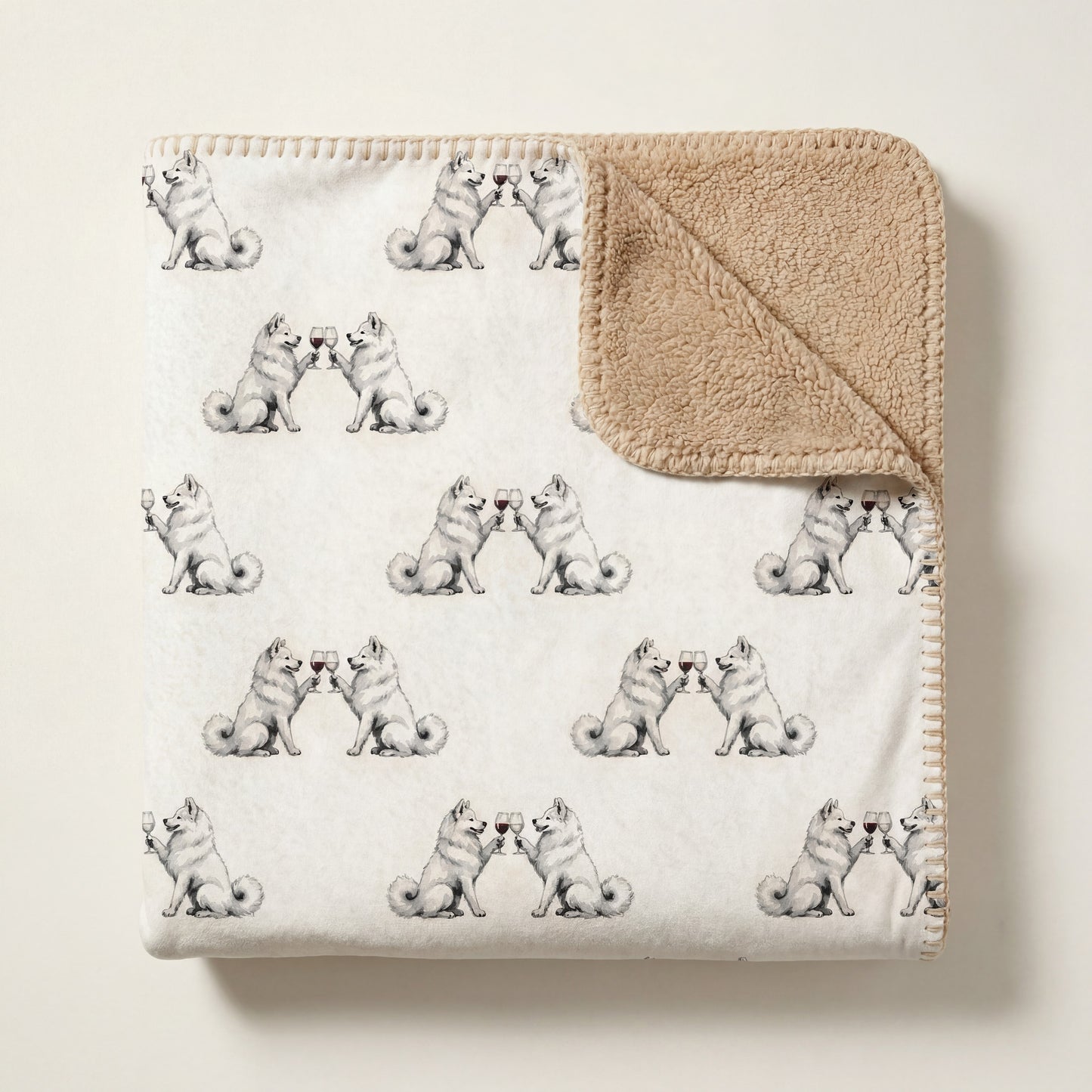 Top-down product photo of the Happy Hour Samoyed sherpa blanket folded on a cream background