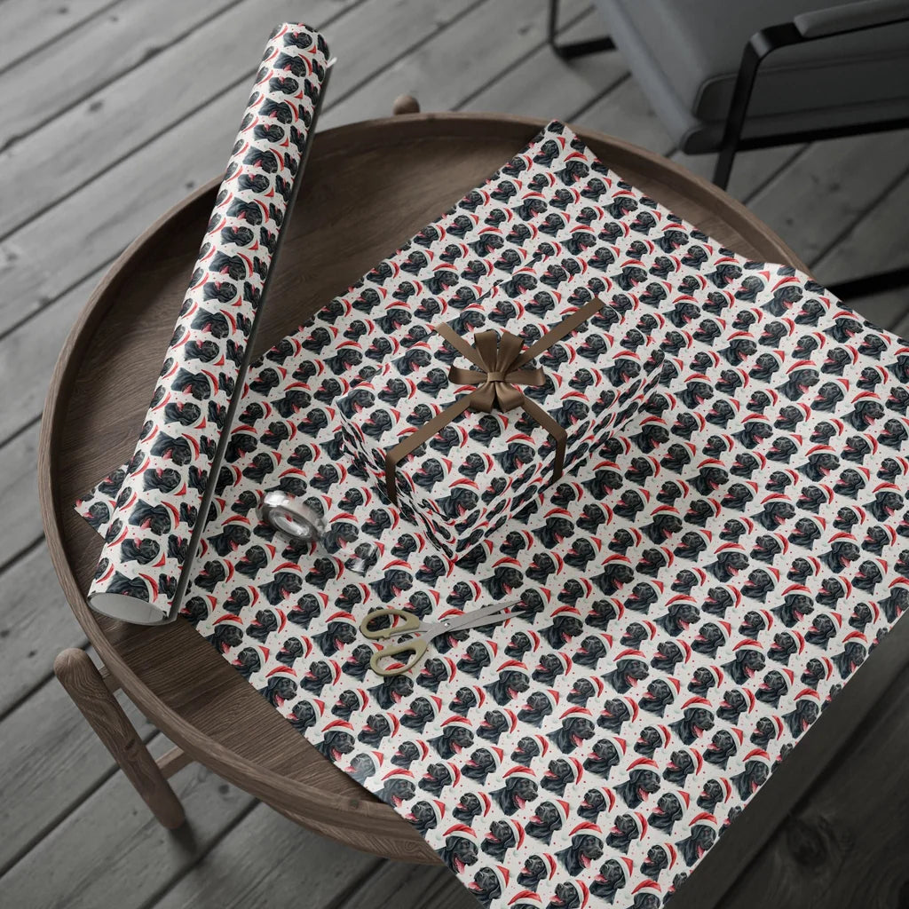 Santa Paws Black Lab Christmas Wrapping Paper — gift wrapping presented on a wooden table